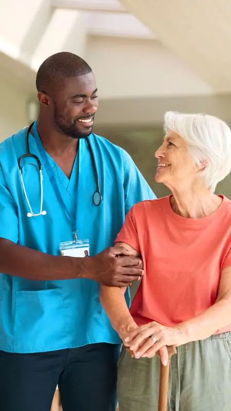 Home Health Care Worker assisting an elderly lady as seen on Health Care Marketing Agency Website